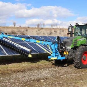 Tractor mounted solar panel cleaner
